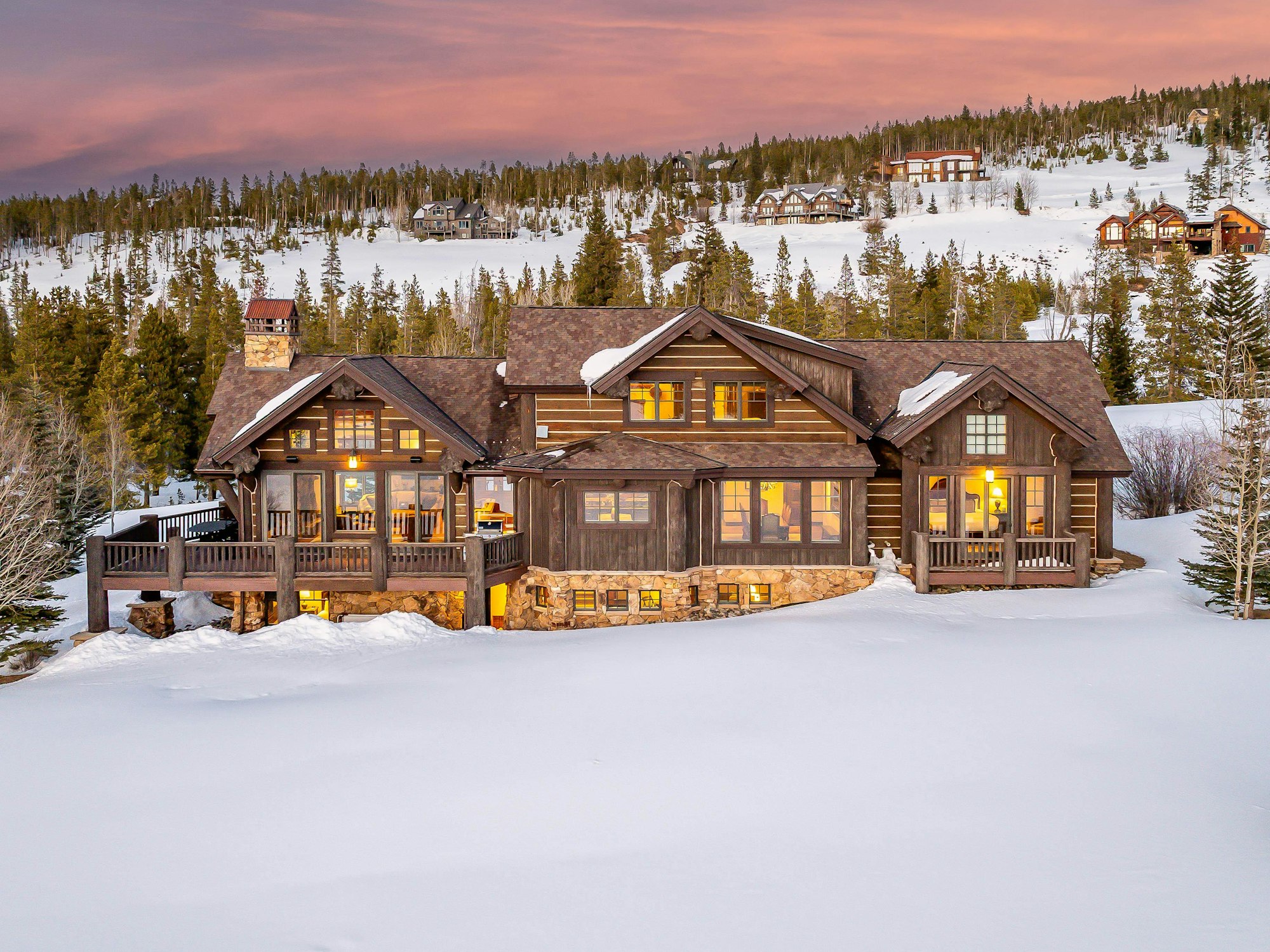 Snowy luxury mountain lodge at sunset in Breckenridge Colorado
