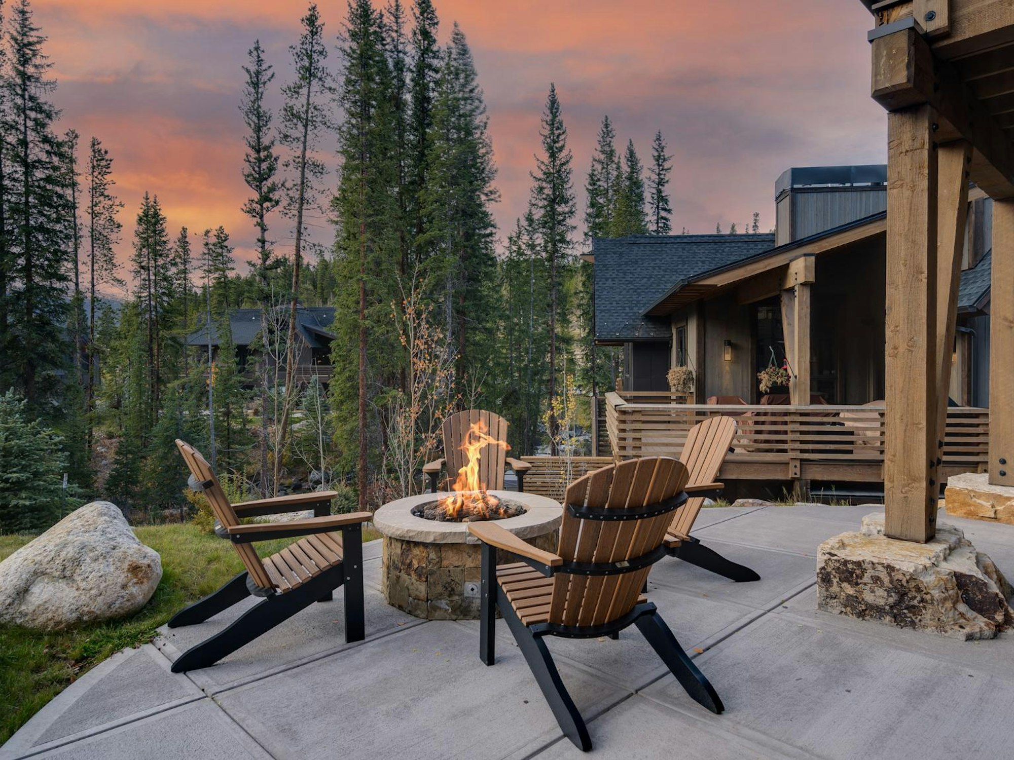 Outdoor fire pit lounge area on a summer evening