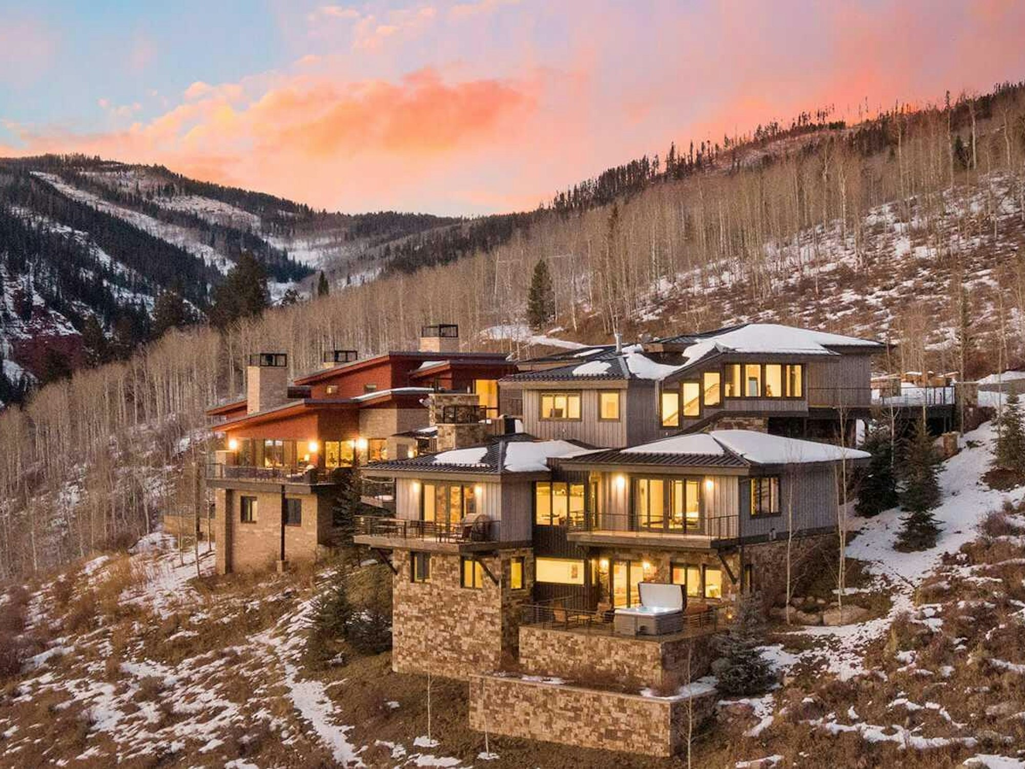 Luxury kitchen with mountain views through floor-to-ceiling windows